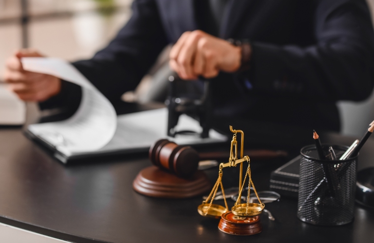 Lawyer is putting a stamp on the document